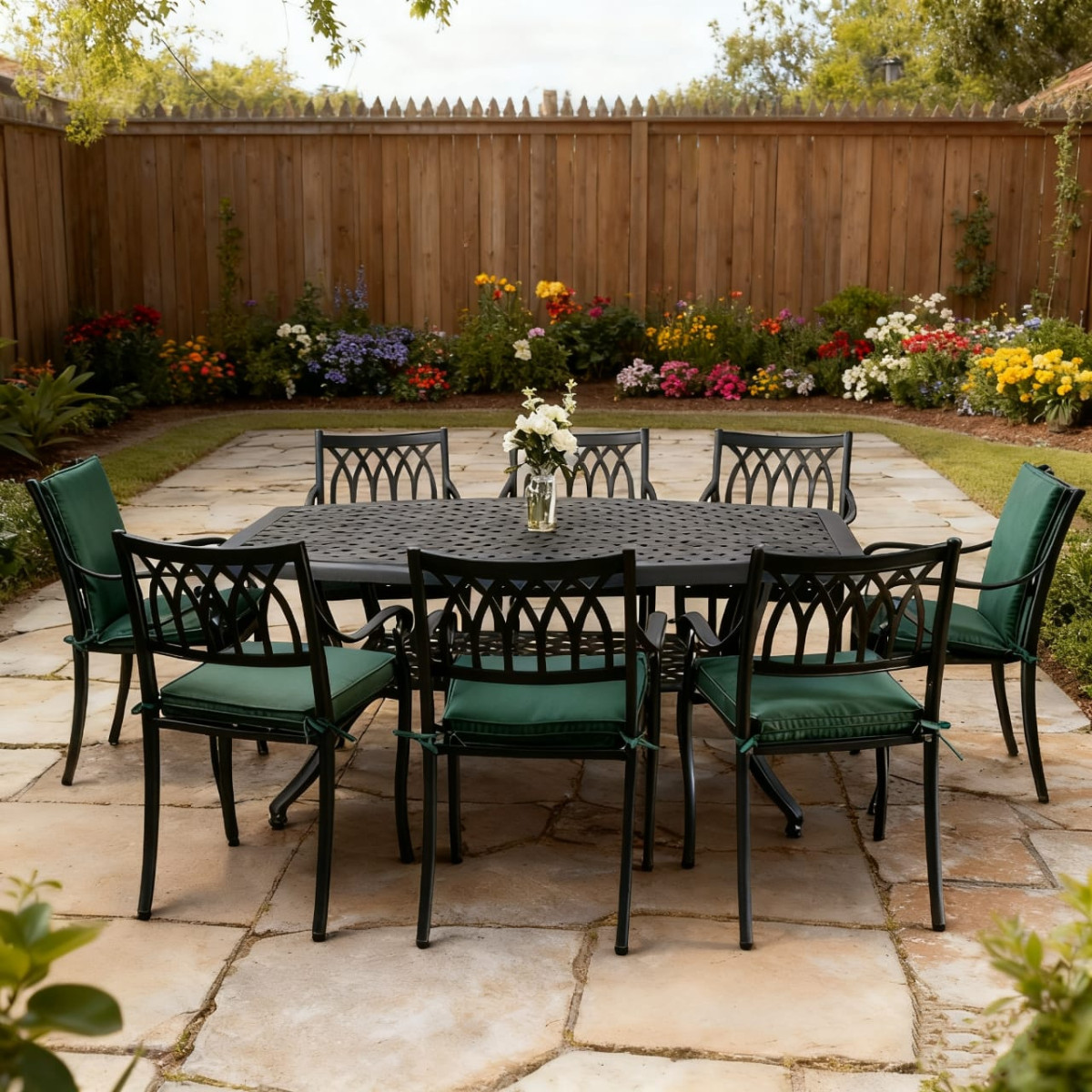 Garden dining table with grey lattice top, surrounded by six chairs with bright lime green cushions and small potted plants.