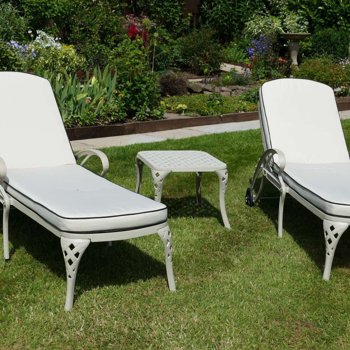 Pair of sun loungers plus one square coffee table. 
