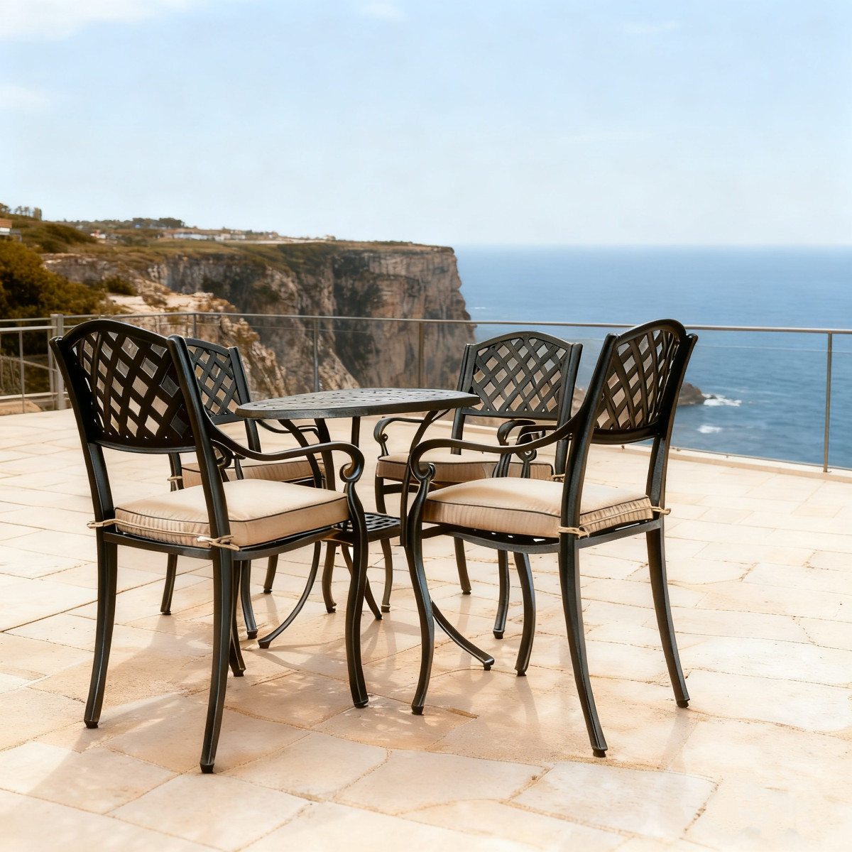 Garden setting featuring a round, black metal table surrounded by four chairs with white cushions on a well-maintained lawn.
