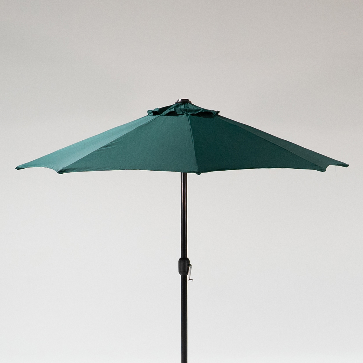 Green garden parasol with a triangular canopy, supported by a black pole, against a plain background.